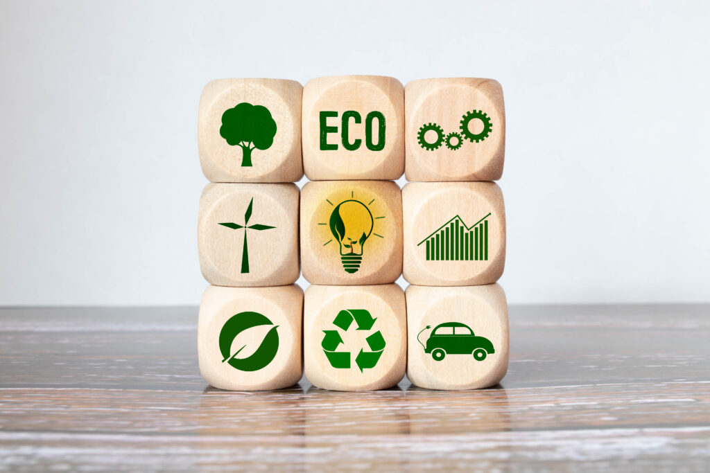 Carbon ecological footprint symbols on wooden cube with eco friendly icon.